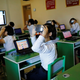 Students at a teachers’ training college use VR glasses during a government-organized visit.